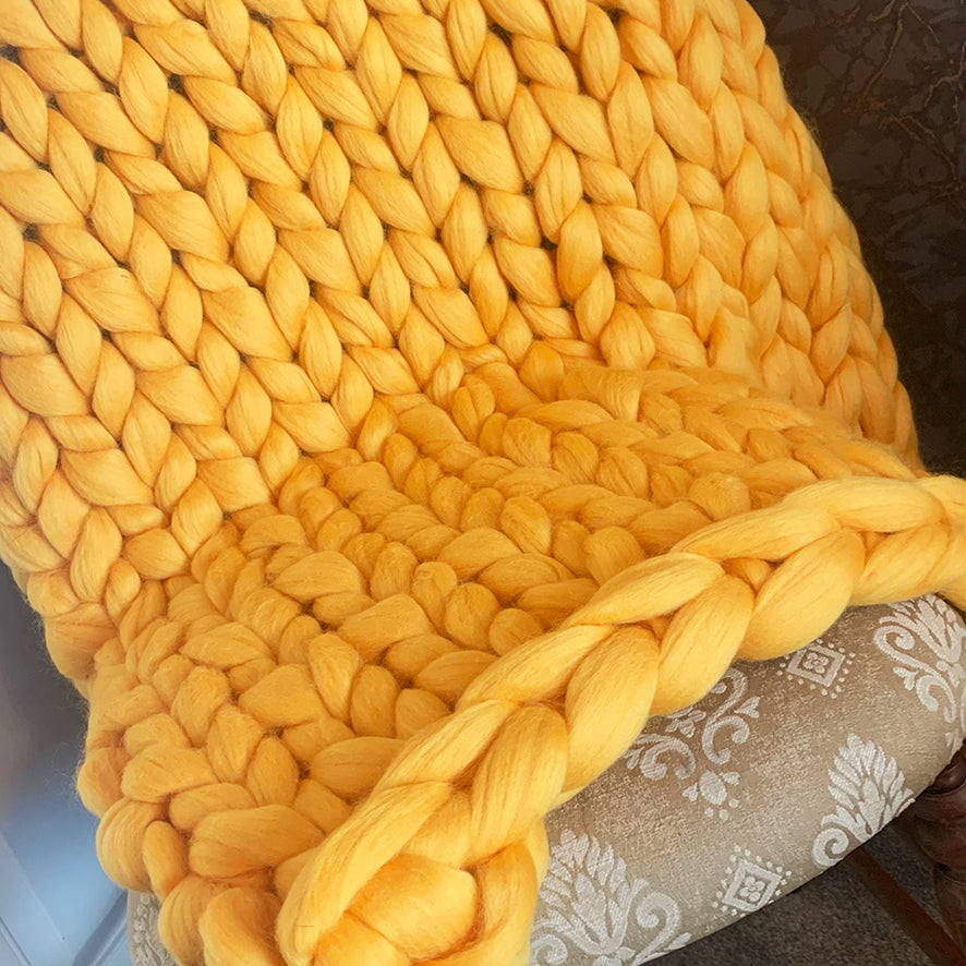 chunky knit blanket in sunset yellow