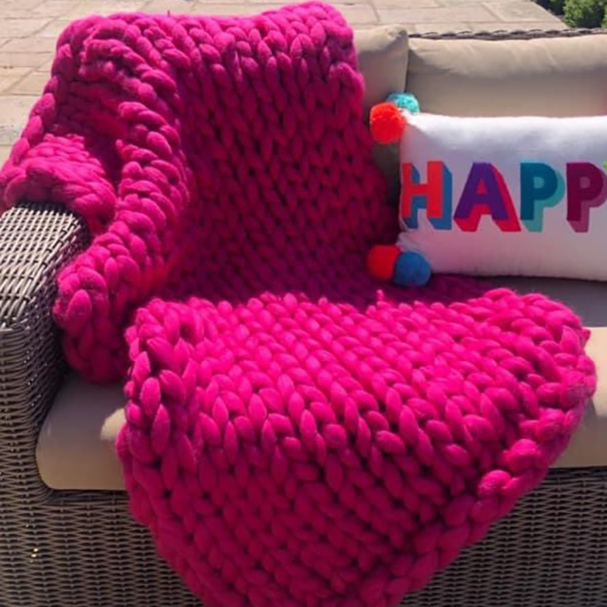 giant chunky knitted blanket in bright pink